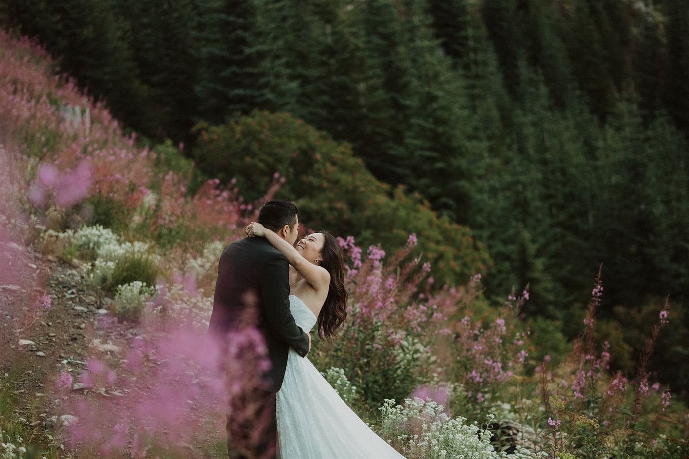Couple hiking through wildflower field during their elopement in Chilliwack, BC.